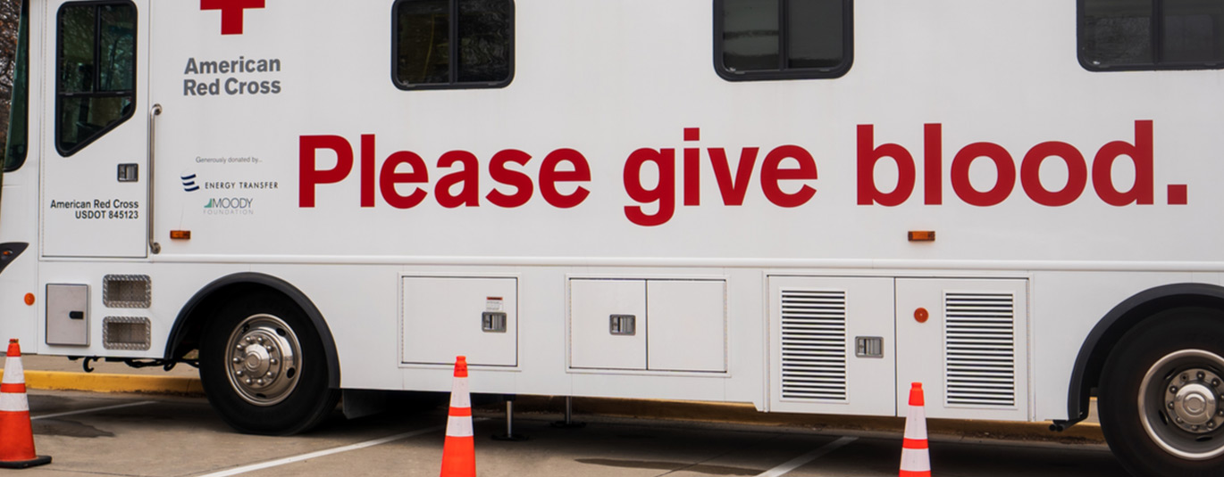 American Red Cross blood donation bus parked outside