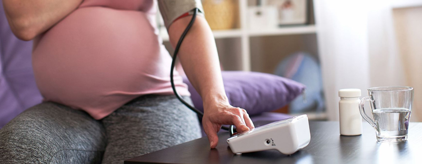 Pregnant Woman Checking Her Blood Pressure